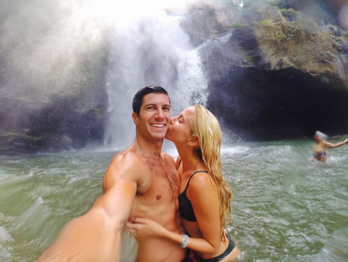 Couple under a waterfall