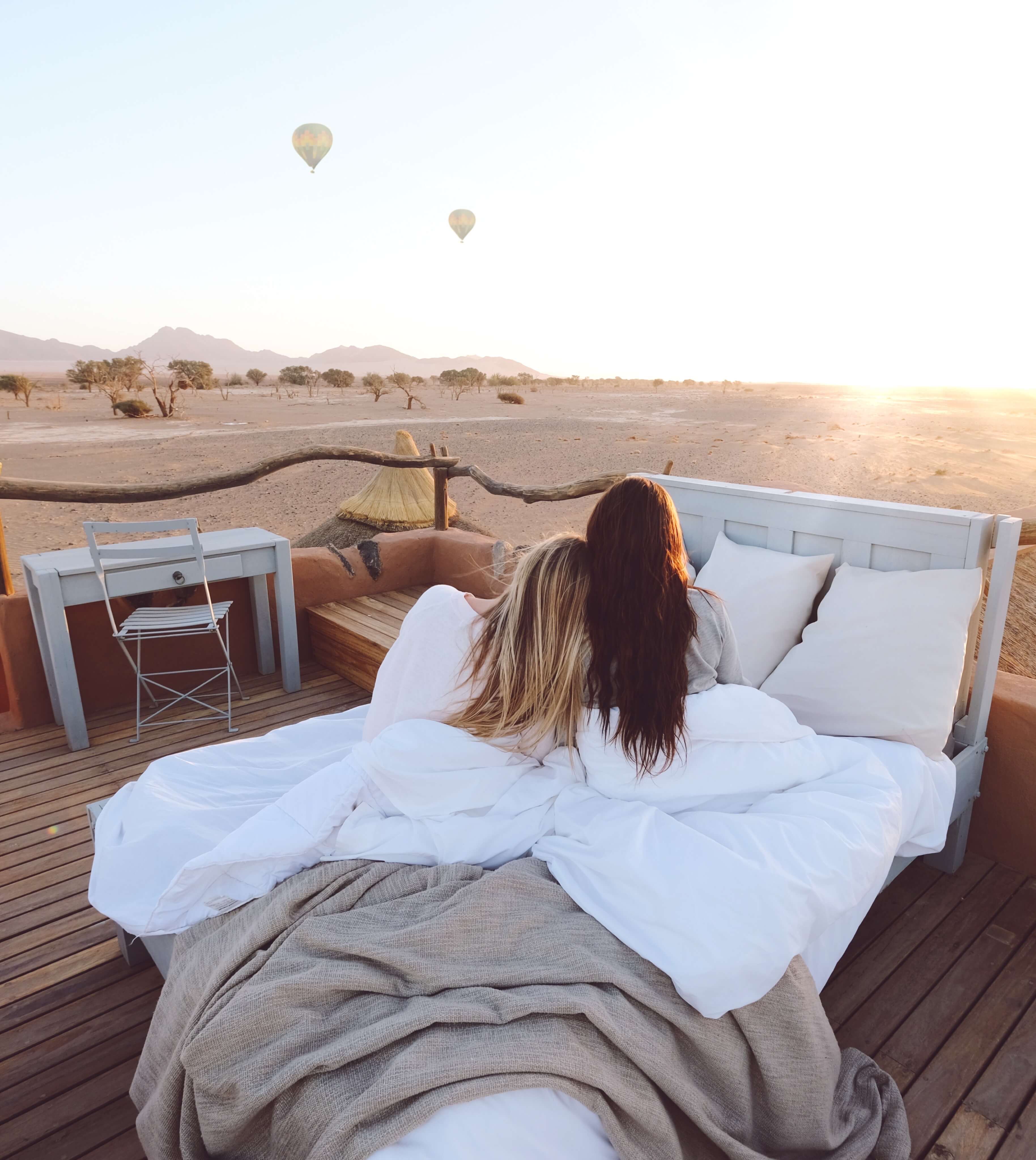 girlfriends watching sunset in namibia