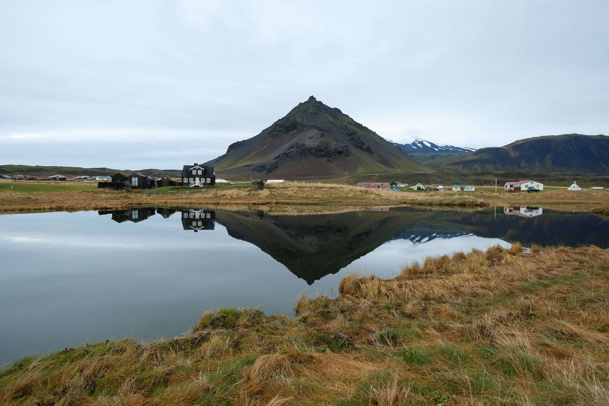 Reflective lake in Arnarstapi