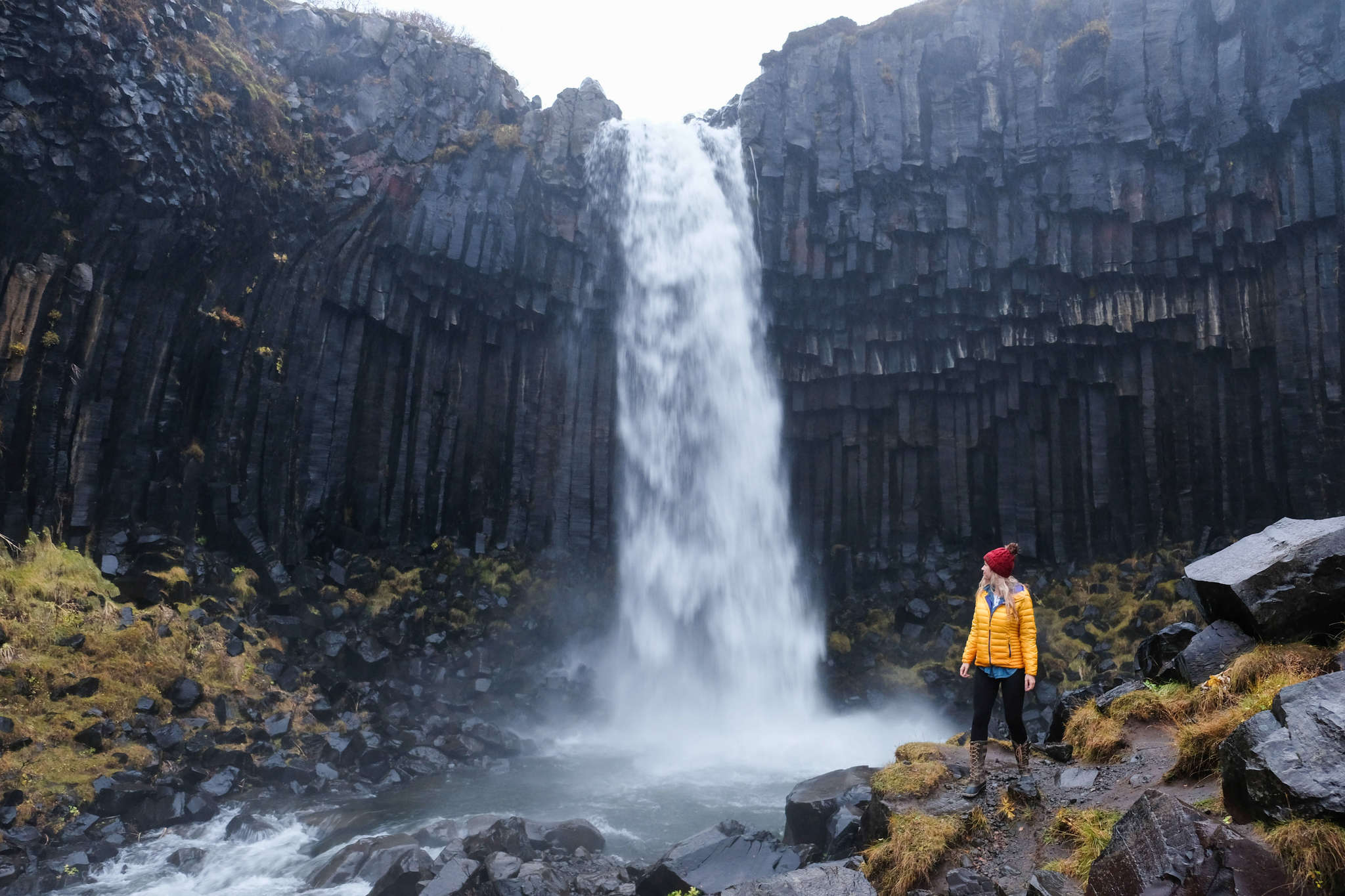 girl at the Svartifoss waterfall