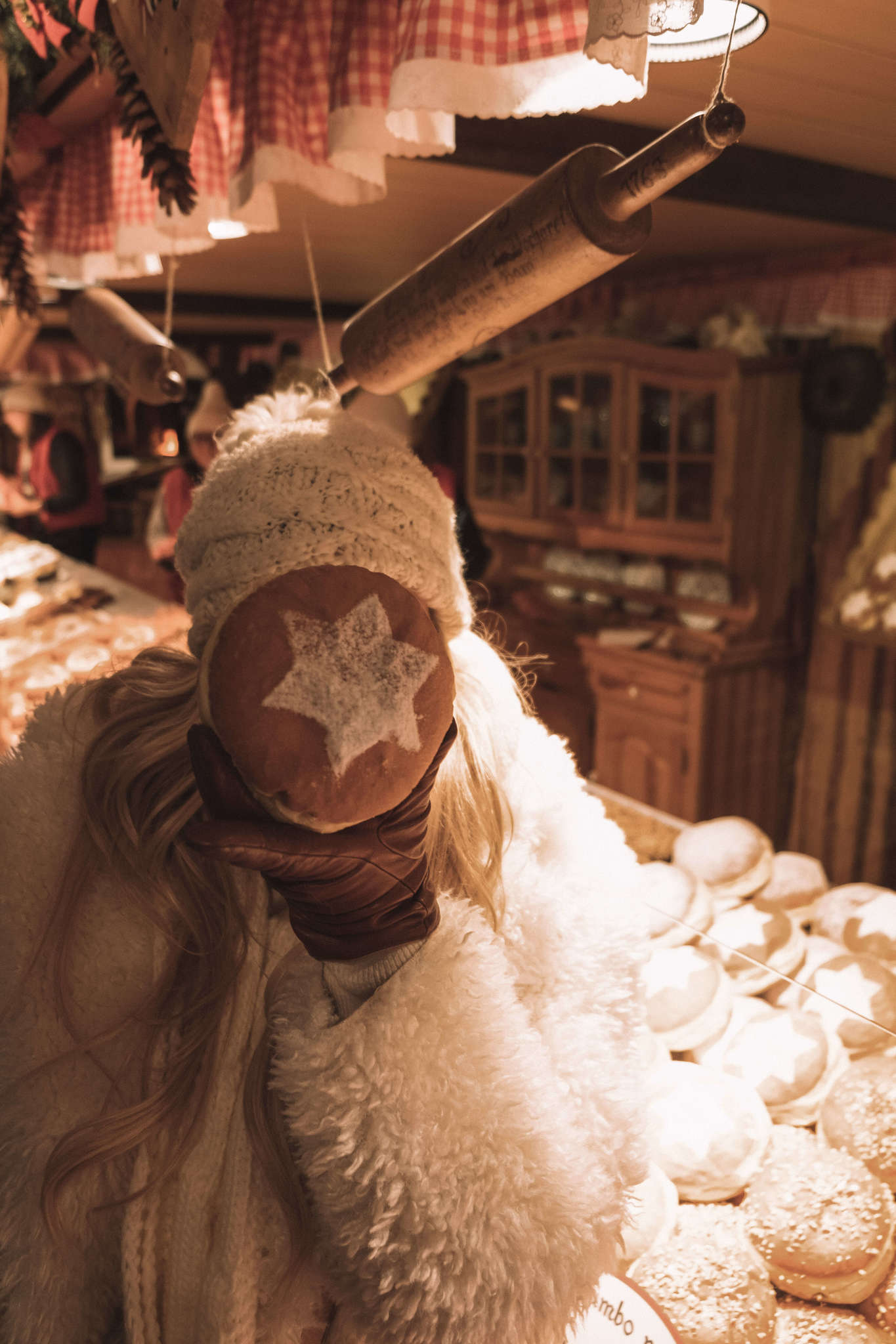 Blonde with Donuts at christmas market in Vienna, Austria