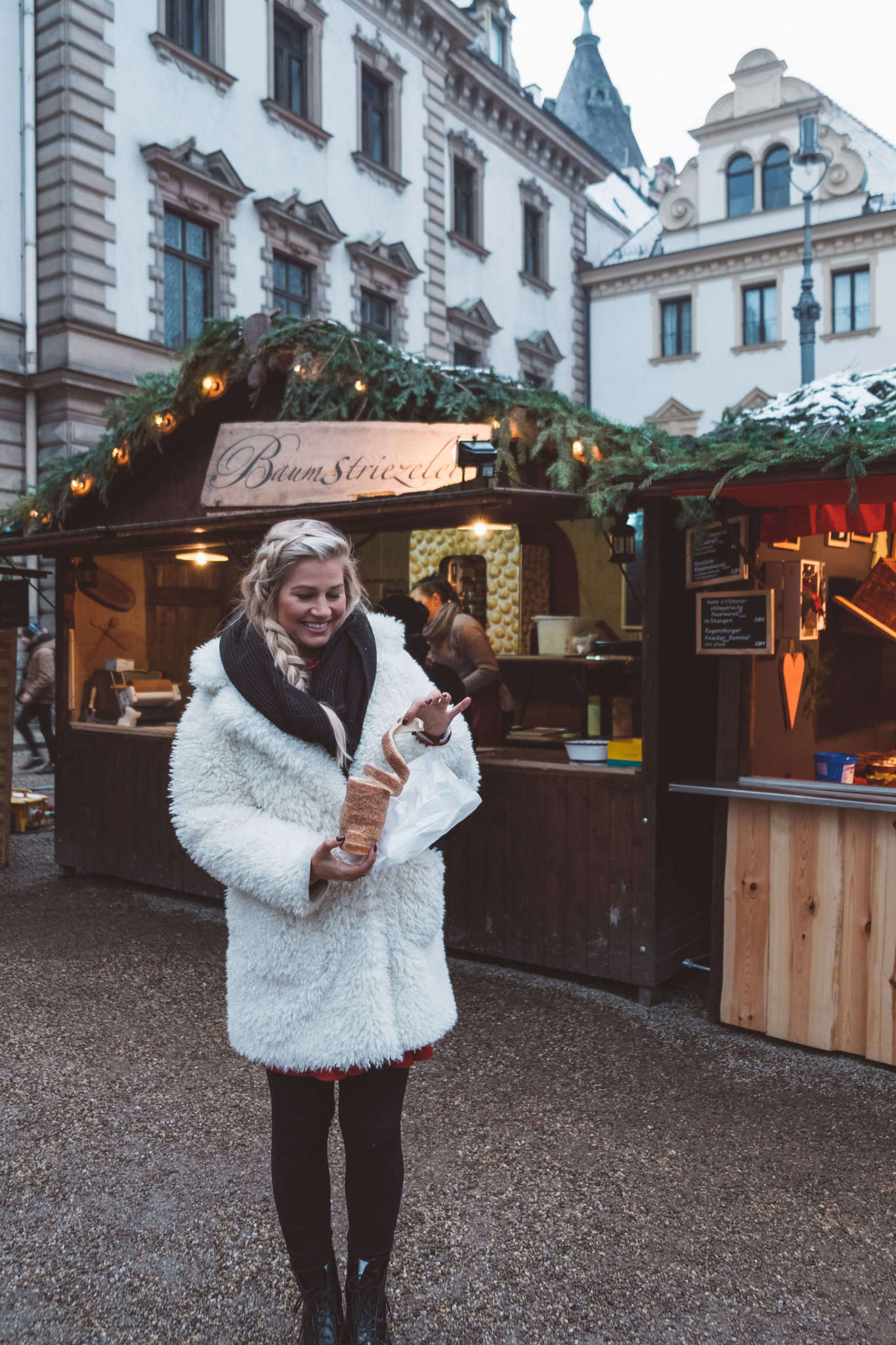 blonde with chimney cake in Regensburg