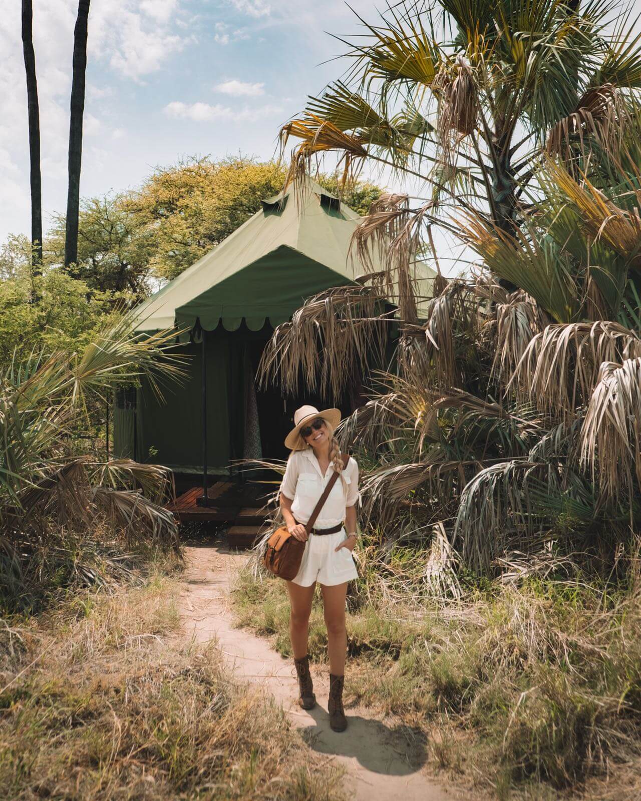 Blonde outside tent at Jack's Camp