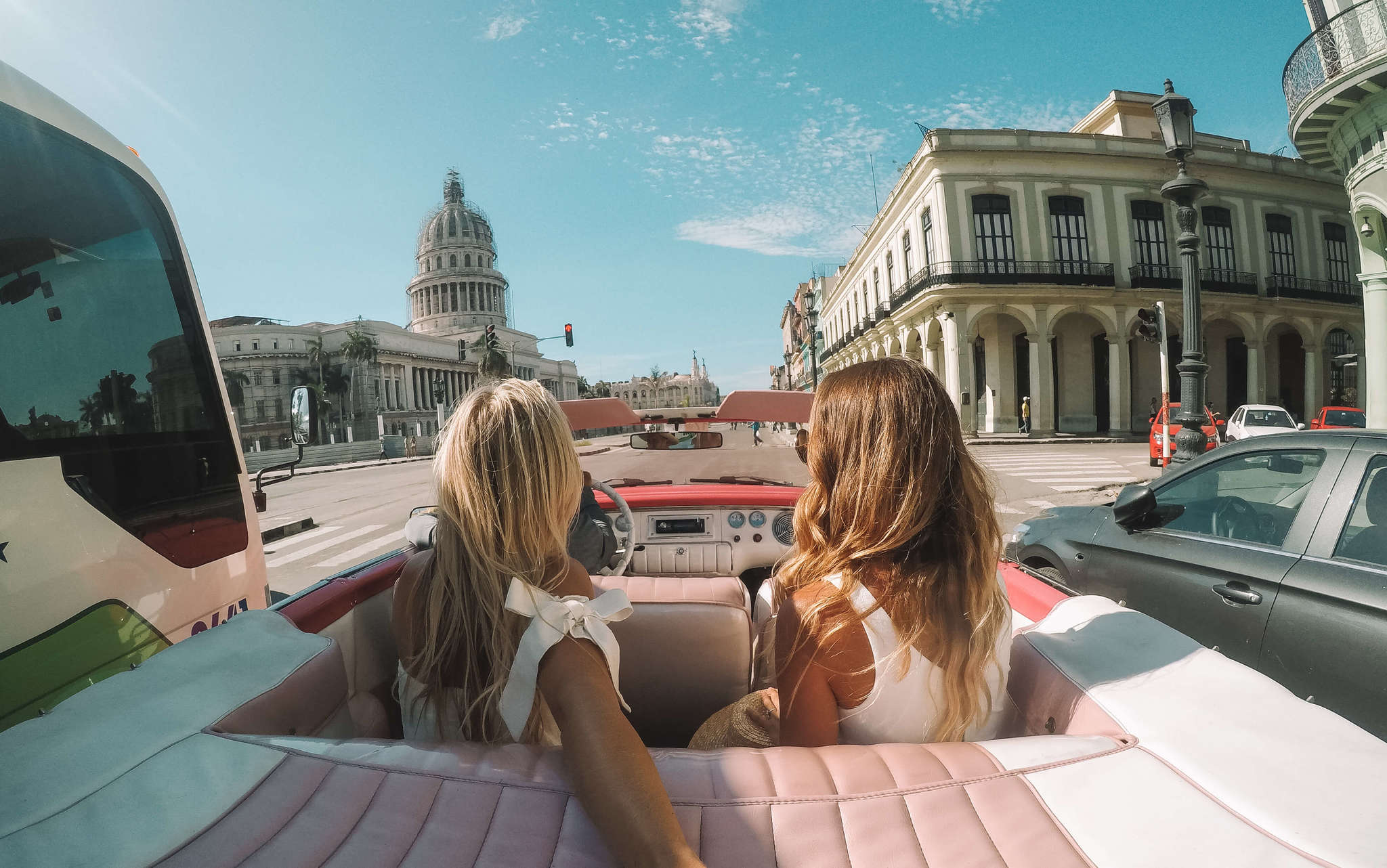 Best friends in car in Havana, Cuba