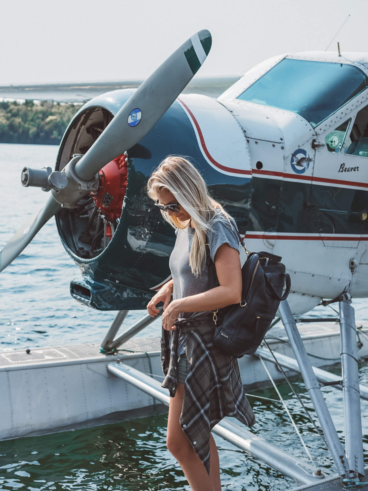 Blonde taking sea plane in Quebéc