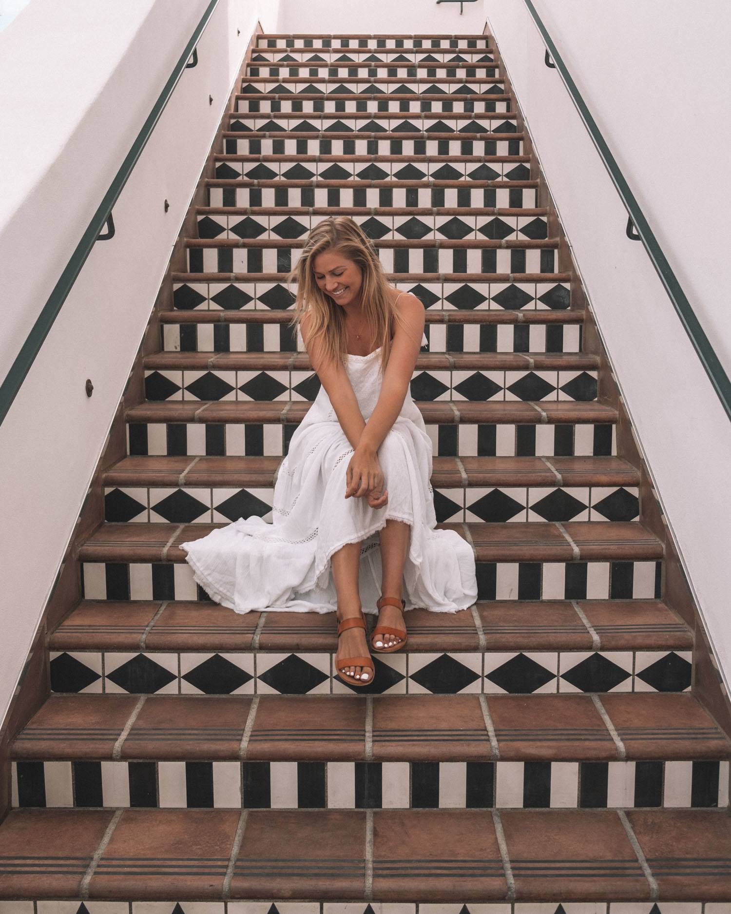 Blonde on tiled stairs at the Hotel Californian