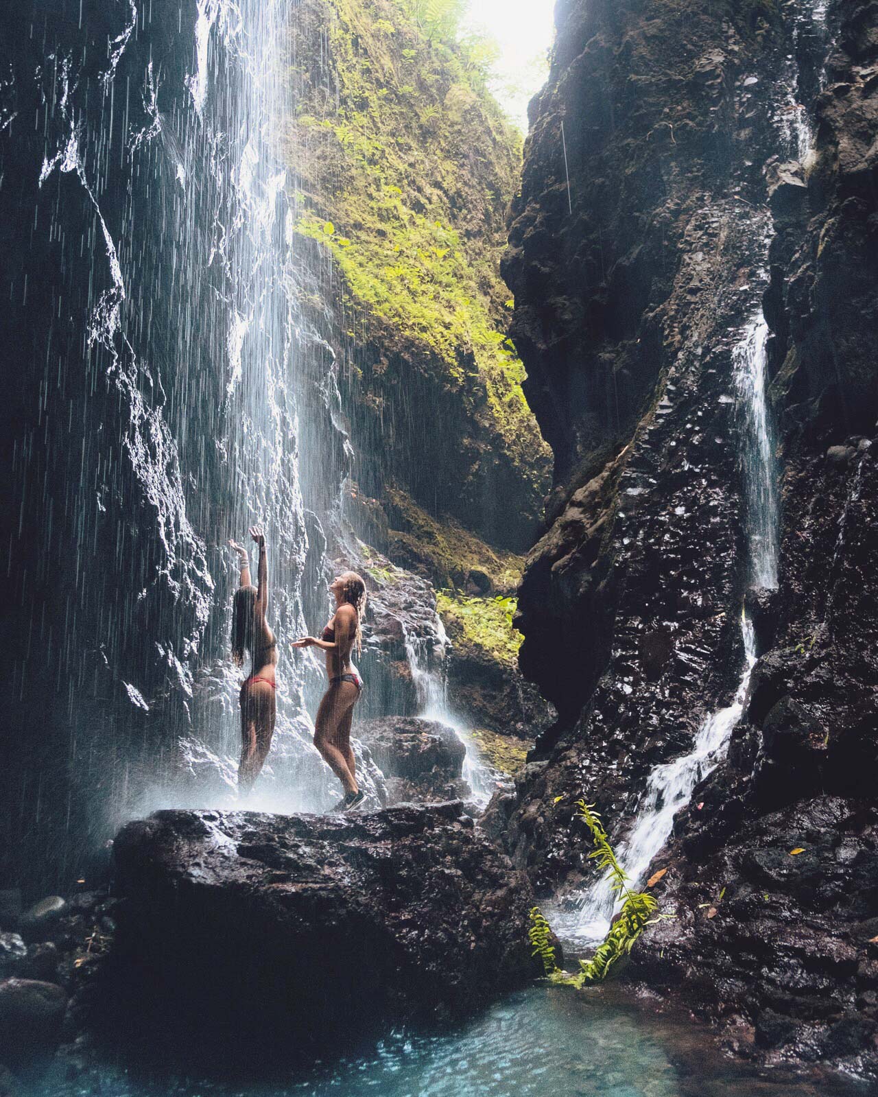 Friends at Waterfall in French Polynesia